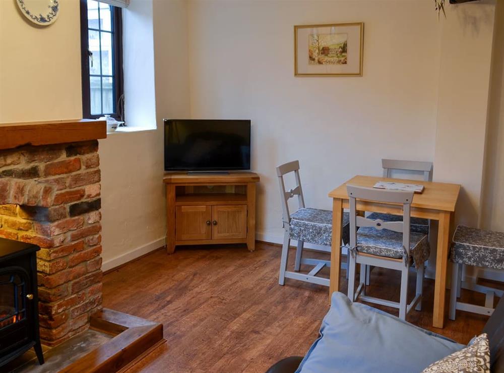 Cosy living/dining room at Ikkle Cottage in Old Blidworth, near Mansfield, Nottinghamshire