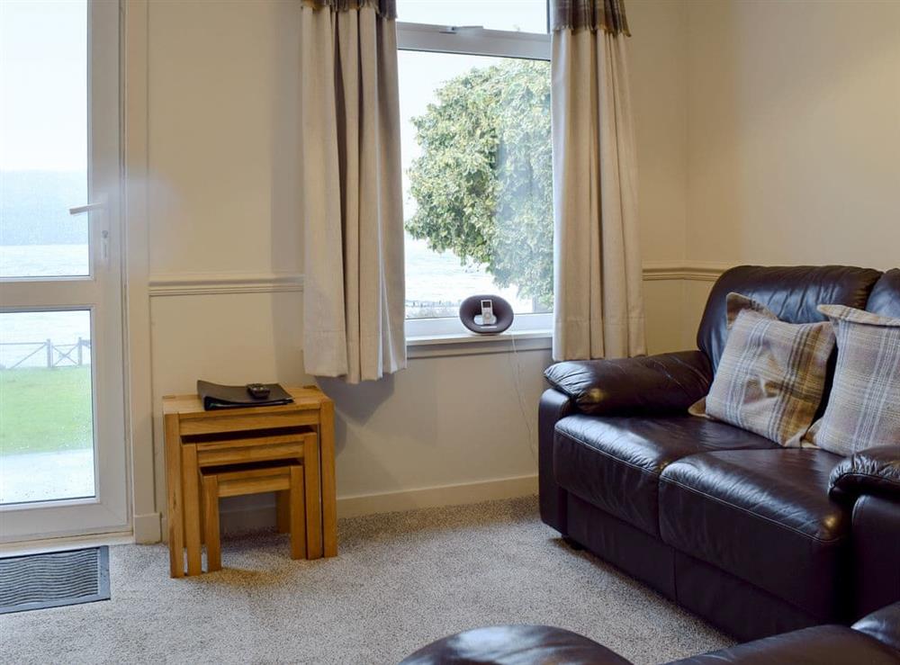 Living room/dining room with Loch views at Balloch Apartment,