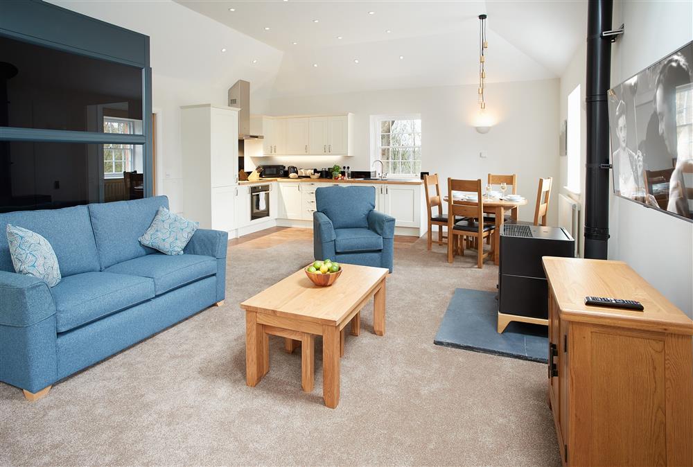 Contemporary living area with sitting room, dining area and well-equipped kitchen (photo 2) at Independent Apartment, Netherby Hall, Longtown