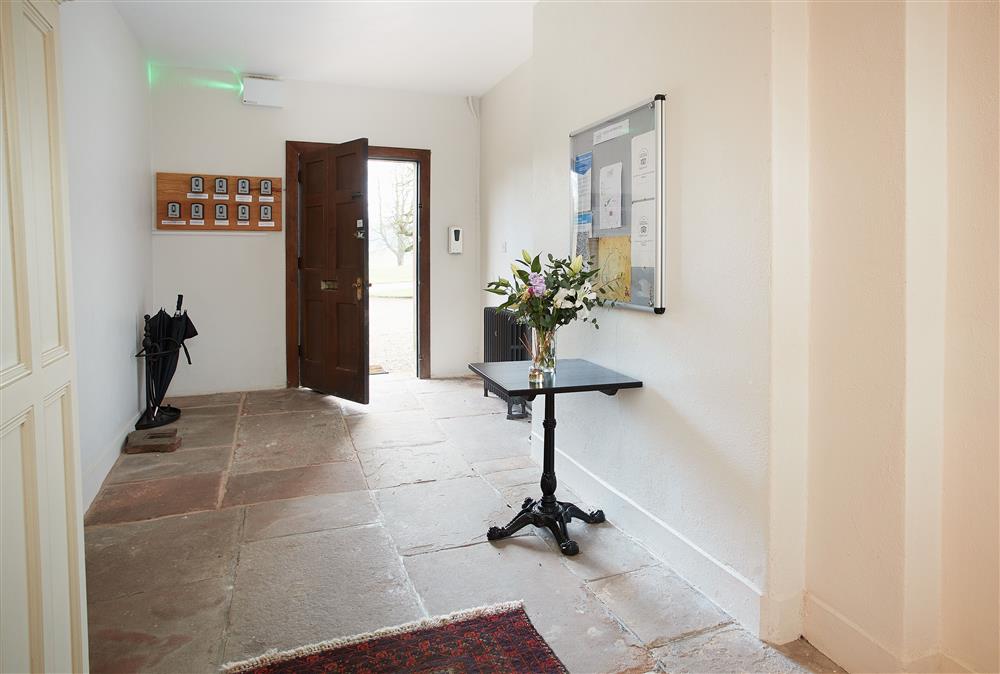 Spacious entrance hall with lift  at Independent Apartment, Netherby Hall, Longtown