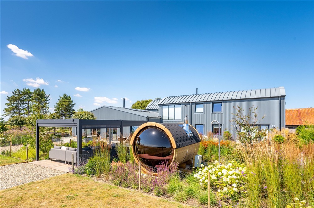 Beautifully presented, both inside and out with covered terrace and the Sauna with views over the fields