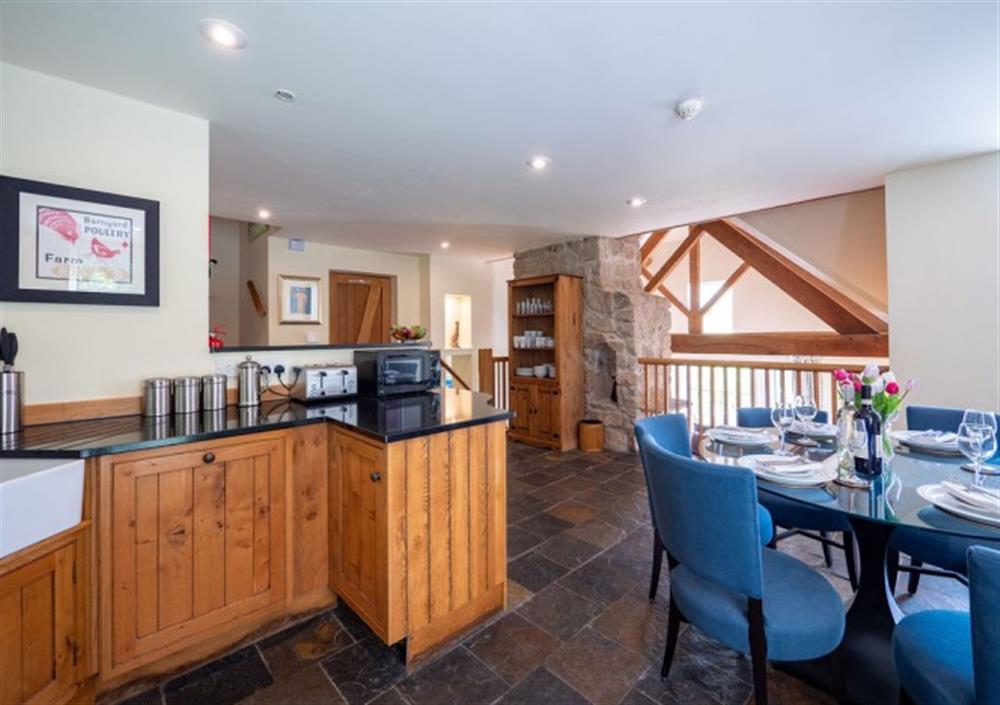 Open-plan kitchen/diner with balcony down to the sitting room at Ingle Tor in Chagford