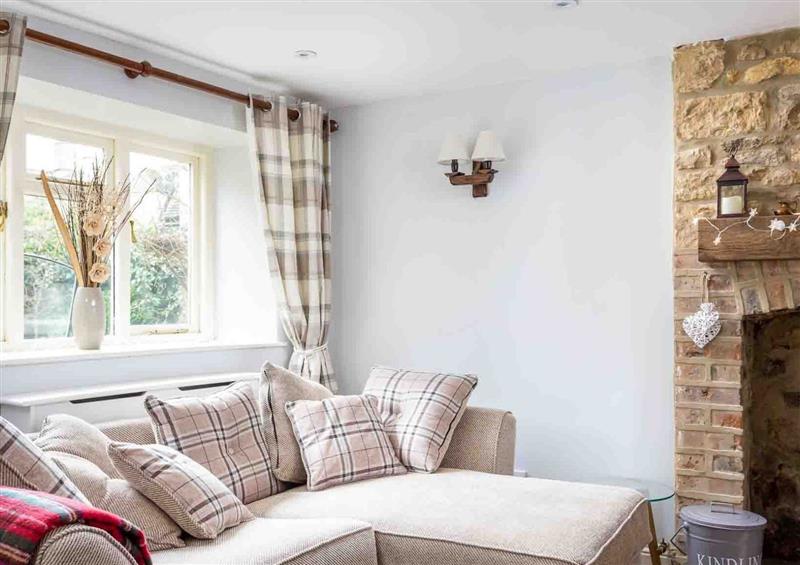 Relax in the living area at Inglenook Cottage, Bourton-on-the-Water