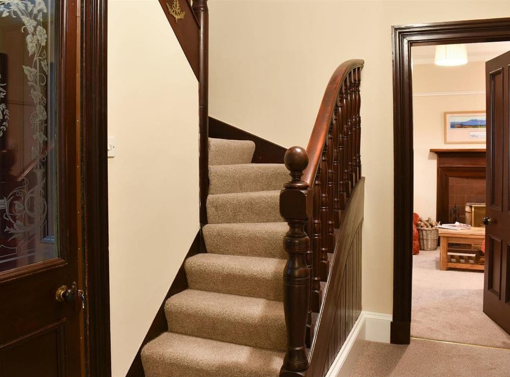 Hallway with turning staircase and delightful decorative features at Ingleside in Whiting Bay, Isle of Arran, Scotland