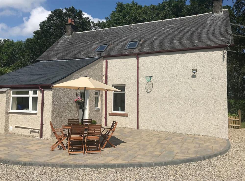 Lovely detached cottage with gravelled area and paved patio with furniture at Ingleside in Whiting Bay, Isle of Arran, Scotland