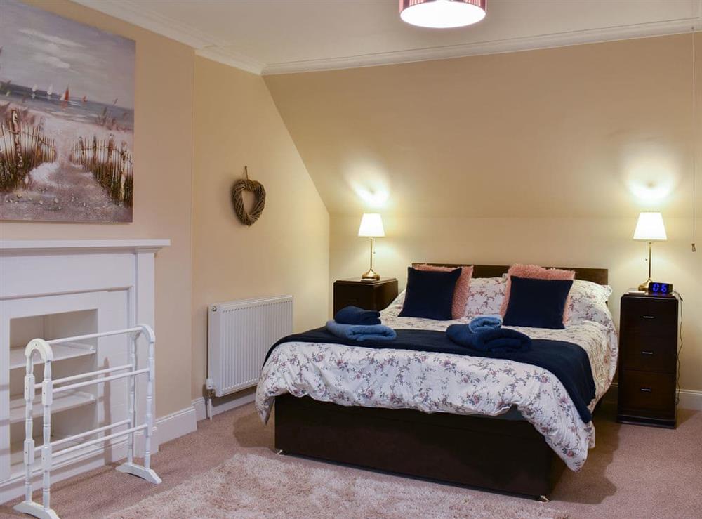 Welcoming bedroom with double bed at Ingleside in Whiting Bay, Isle of Arran, Scotland