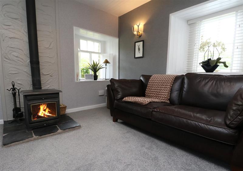 Enjoy the living room at Inglis Nook Cottage, Balquhidder