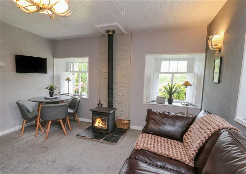 Relax in the living area at Inglis Nook Cottage, Balquhidder