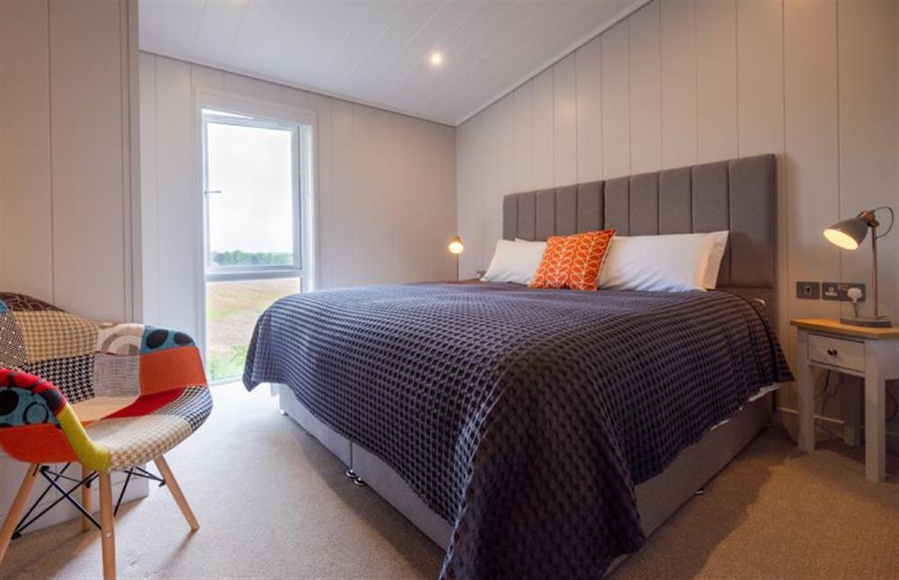 Ground floor: Bedroom two with super-king size zip and link bed at Ingol Lodge, Ingoldisthorpe near Kings Lynn