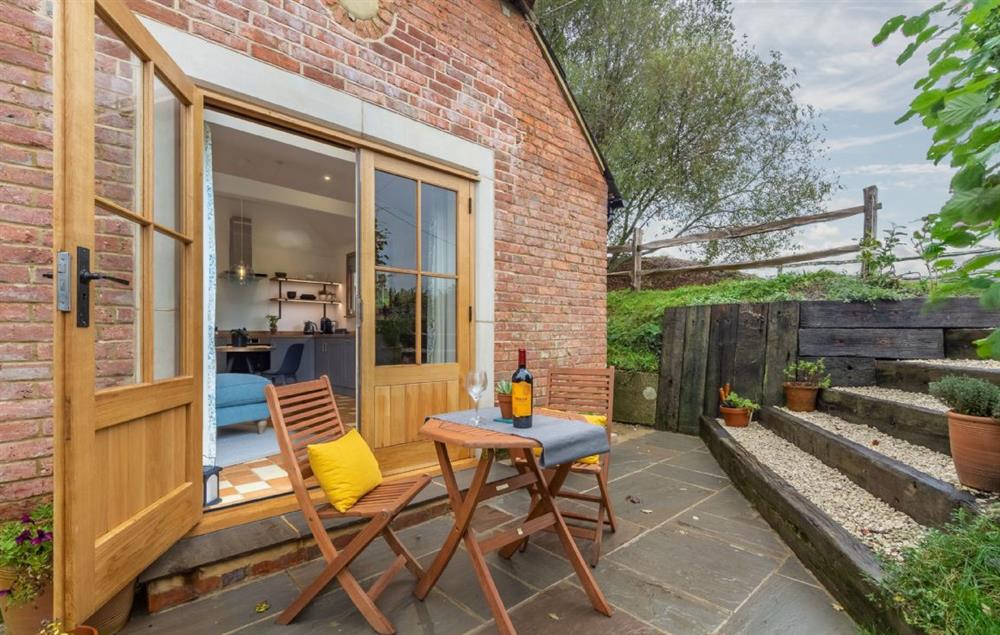 From the french doors leading out onto the sunken terrace with steps leading up to the lawn garden  at Inkpen Cottage, Robertsbridge