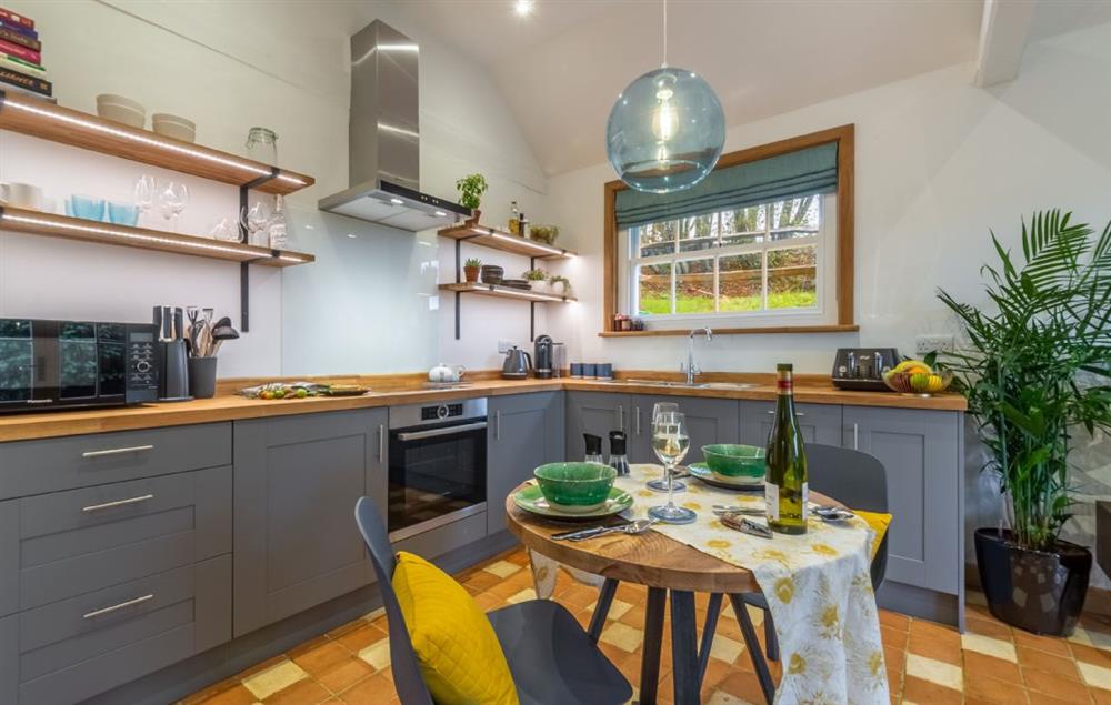 Open-plan kitchen with seating for two at Inkpen Cottage, Robertsbridge