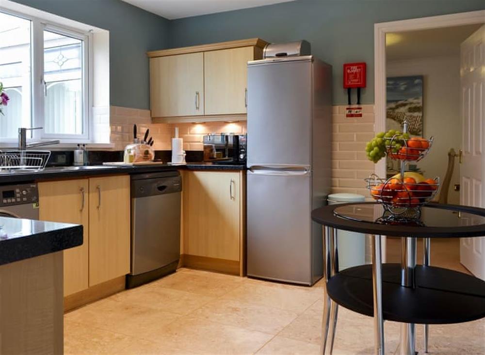 Fitted kitchen with breakfast area (photo 2) at Inland View in Trearddur Bay, near Holyhead, Anglesey, Gwynedd