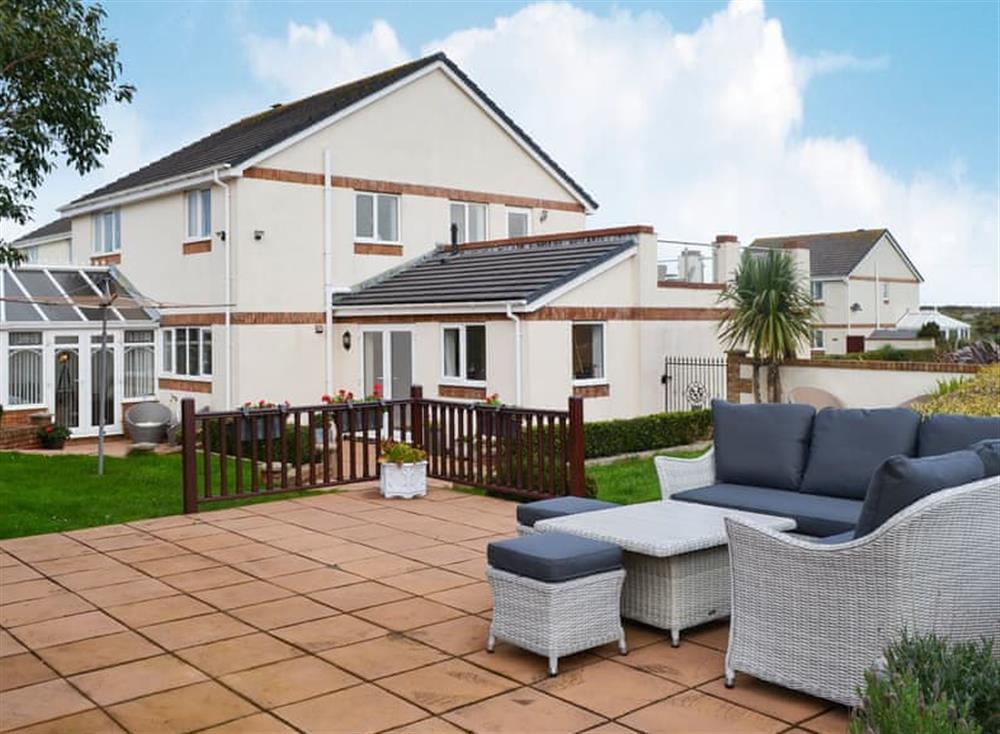 Patio with garden furniture at Inland View in Trearddur Bay, near Holyhead, Anglesey, Gwynedd