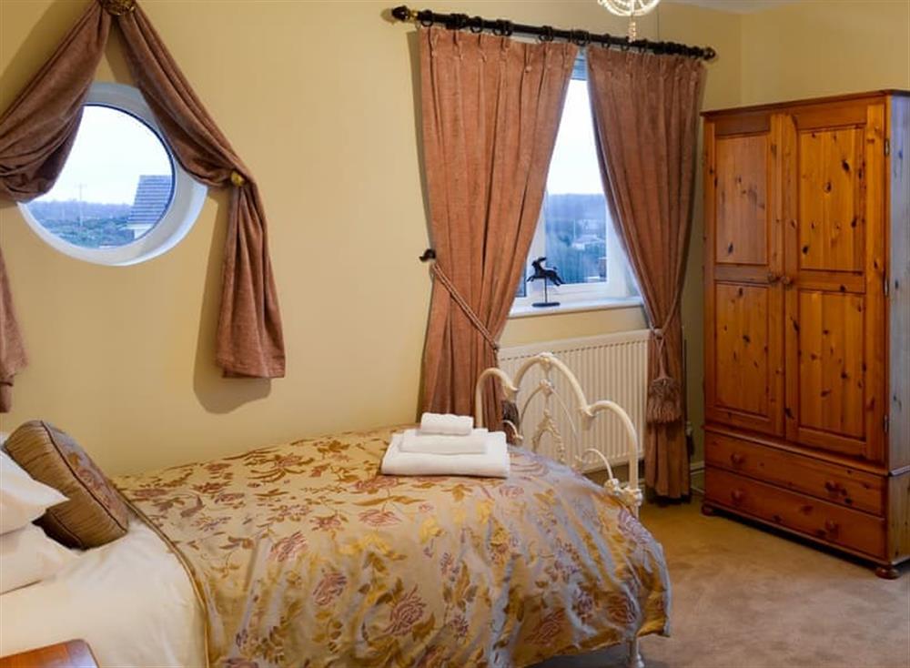 Single bedroom leading to the balcony (photo 2) at Inland View in Trearddur Bay, near Holyhead, Anglesey, Gwynedd