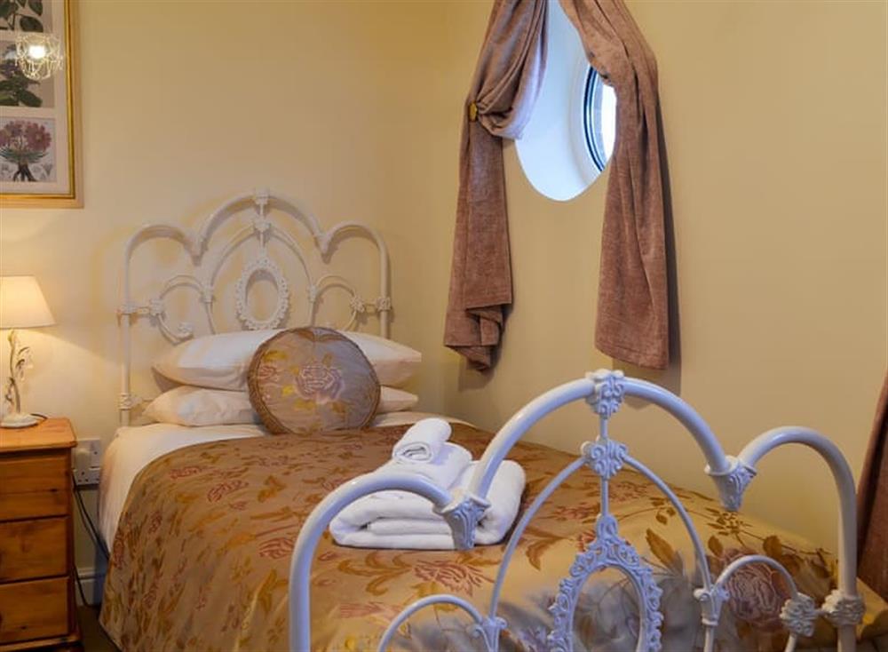 Single bedroom leading to the balcony at Inland View in Trearddur Bay, near Holyhead, Anglesey, Gwynedd