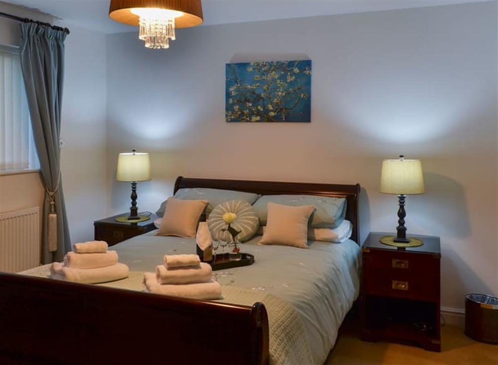 Tranquil bedroom with kingsize bed and en-suite at Inland View in Trearddur Bay, near Holyhead, Anglesey, Gwynedd