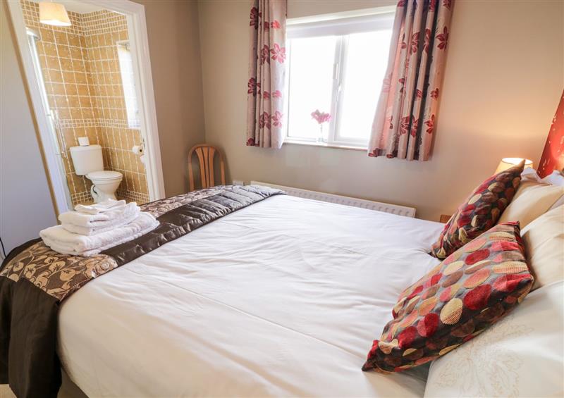 This is a bedroom at Inverbeg Cottage 1, Downings