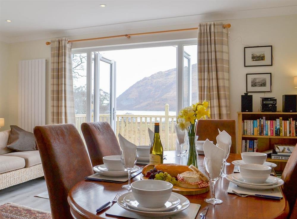Delightful spacious living/dining area eith French doors to the decked area at Invernoe Cottage in Taynuilt, near Oban, Argyll and Bute, Scotland