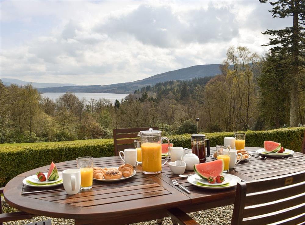 Outdoor eating area with spectacular views at The McGregor Apartment,