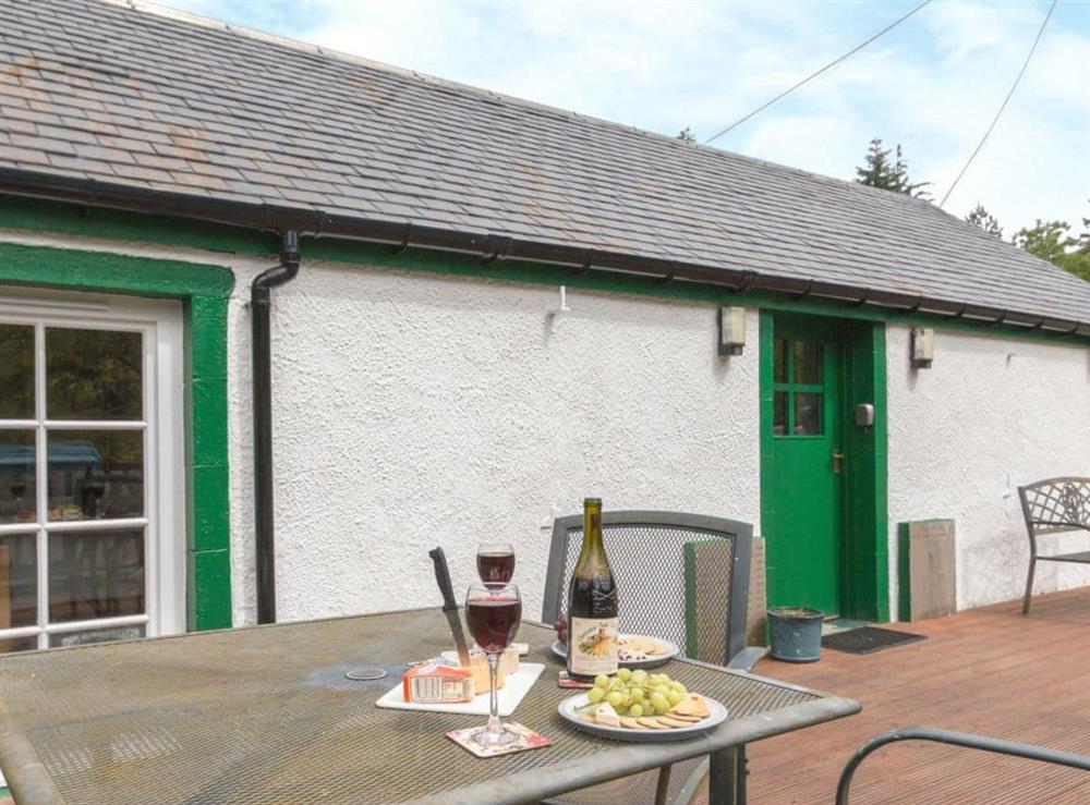 Small enclosed decked area with garden furniture at Bonnies Bothy, 