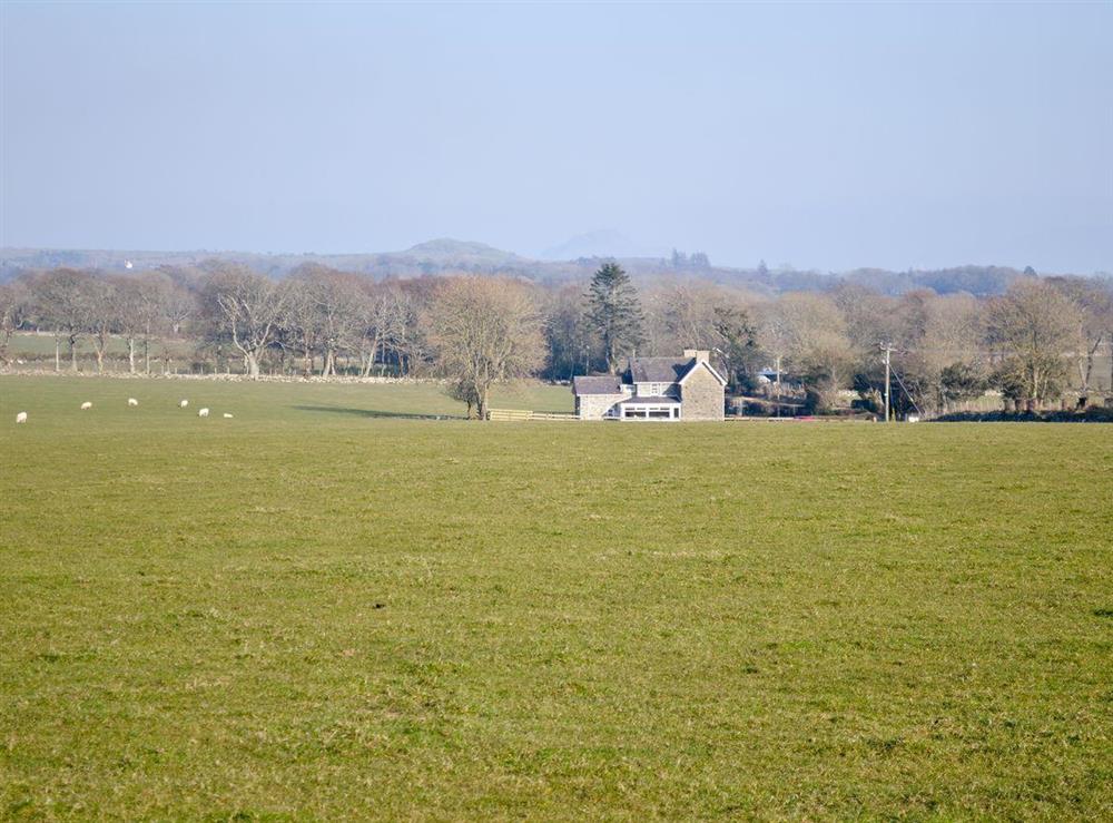 Rear of property from a distance at Isfryn in Criccieth, Gwynedd