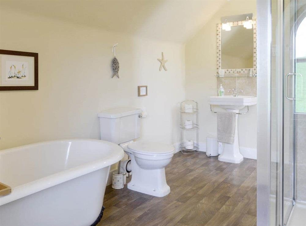 Bathroom with bath and separate shower cubicle at Islabank Farmhouse in Meigle, Perthshire., Great Britain