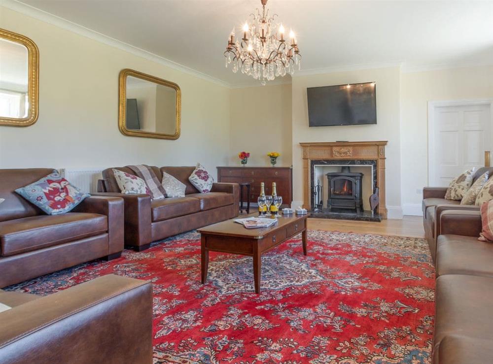 Ample seating within living room at Island Farm House in Staintondale, near Whitby, North Yorkshire