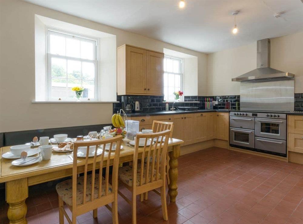 Convenient dining area within kitchen at Island Farm House in Staintondale, near Whitby, North Yorkshire