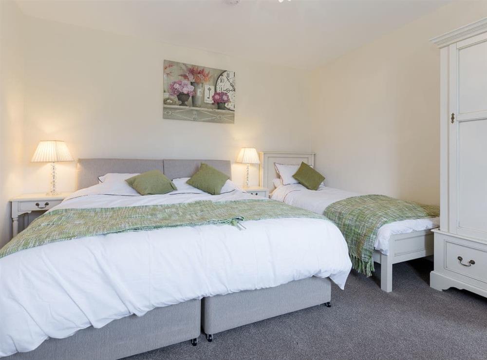 En-suite family bedroom with a double and a single bed at Island Farm House in Staintondale, near Whitby, North Yorkshire