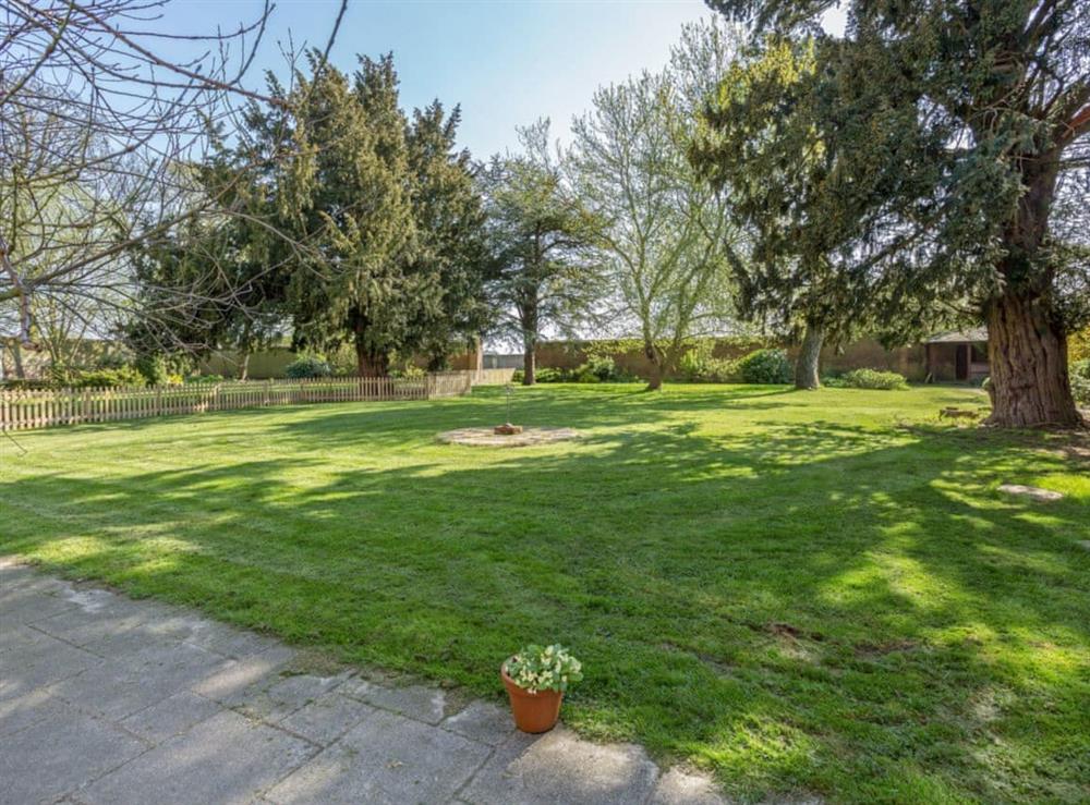 Peaceful enclosed lawned garden at Islington Hall in Tilney All Saints, near King’s Lynn, Norfolk