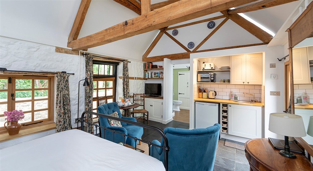 The living and kitchen area of Old Slaughter House, Oxfordshire at Itteringham Manor in Aylsham, Norfolk
