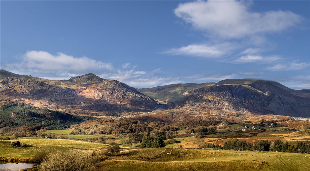 The mountains of Eryri (Snowdonia) surrounding Watkin Bunkhouse, Gwynedd at Itteringham Manor in Aylsham, Norfolk