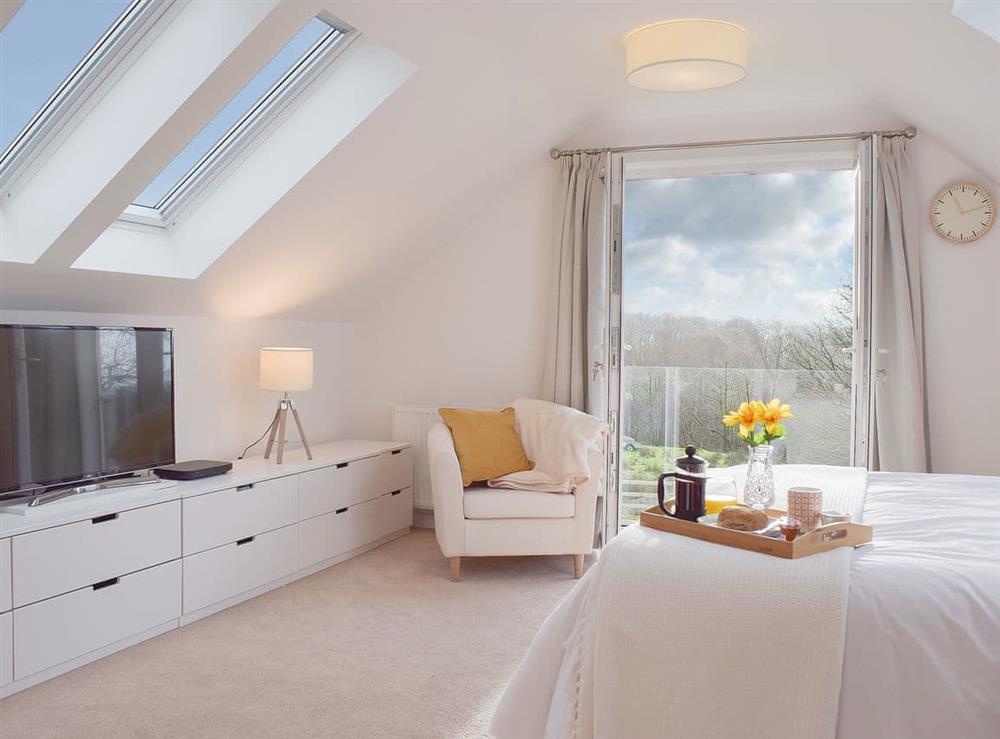 The double bedroom has two roof lights so you can lie back and watch the stars at Ivy Bush Cottage in New Moat, near Narberth, Pembrokeshire, Dyfed