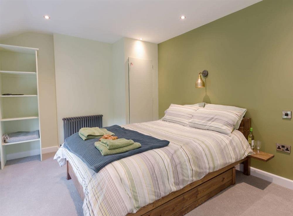 Comfortable bedroom with kingsize bed at Ivy Cottage in Beck Hole, near Whitby, North Yorkshire