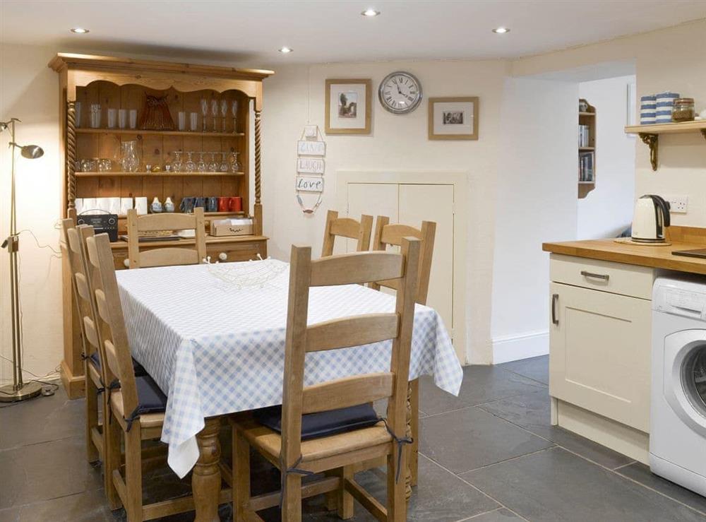 Convenient dining area within kitchen at Ivy Cottage in Boscastle, Cornwall., Great Britain