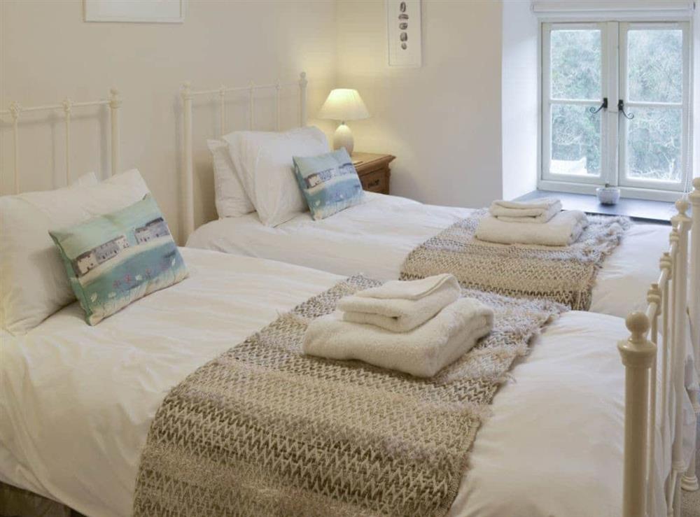 Light and airy twin bedroom at Ivy Cottage in Boscastle, Cornwall., Great Britain