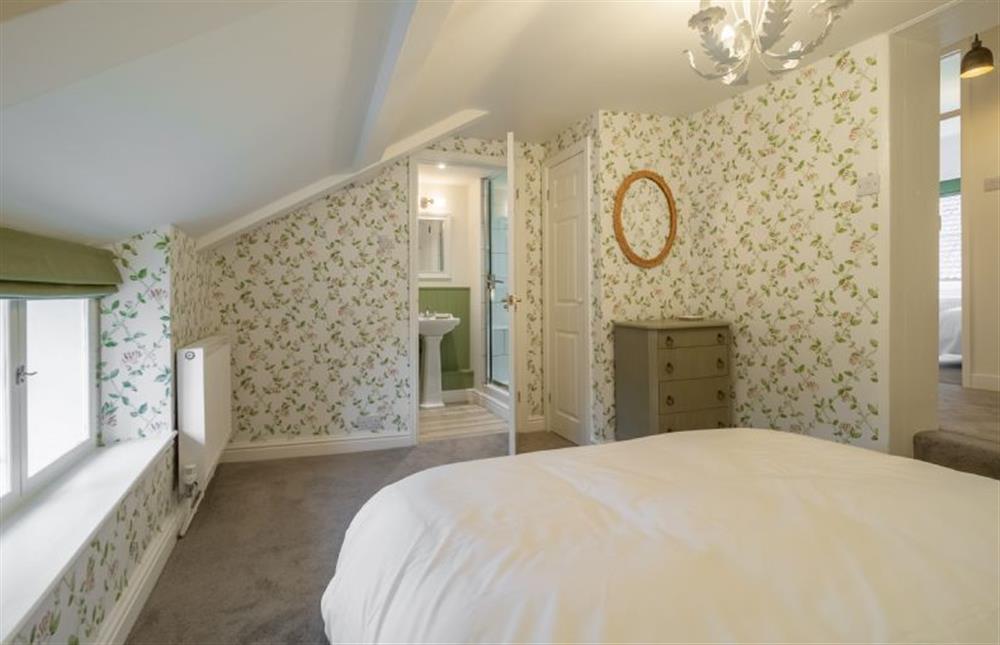 First floor: Master bedroom to en-suite shower room at Ivy Cottage, Burnham Market near Kings Lynn