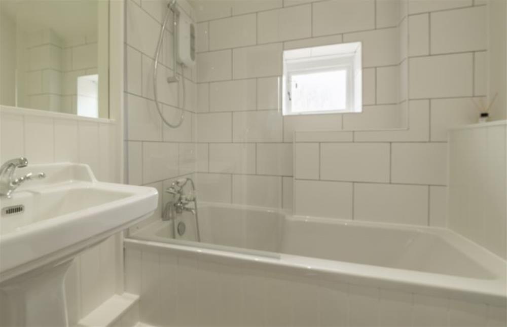 Ground floor: Bathroom with bath, hand-held and overhead shower at Ivy Cottage, Burnham Market near Kings Lynn