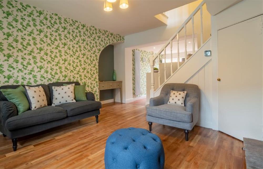 Ground floor: Sitting room with pretty ivy wallpaper at Ivy Cottage, Burnham Market near Kings Lynn