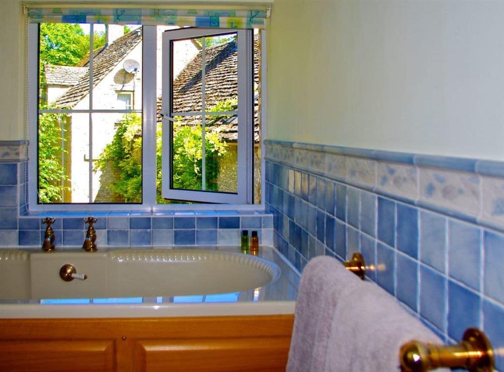 Bathroom with delightful garden views at Ivy Cottage in Chedworth, near Cheltenham, Gloucestershire