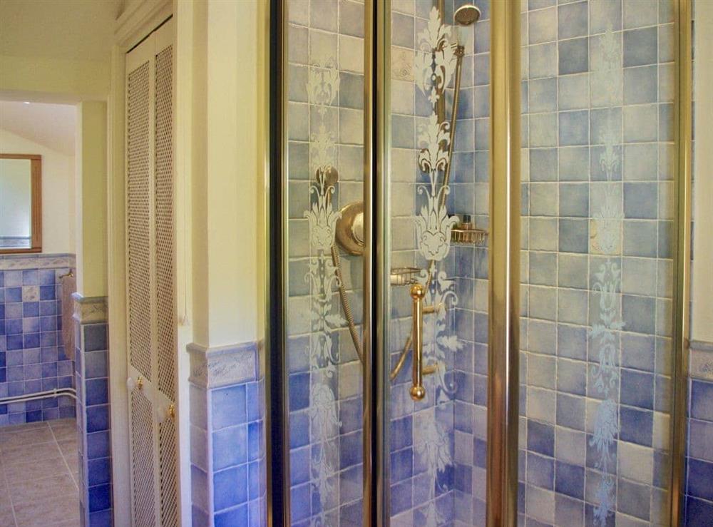 Bathroom with shower cubicle at Ivy Cottage in Chedworth, near Cheltenham, Gloucestershire