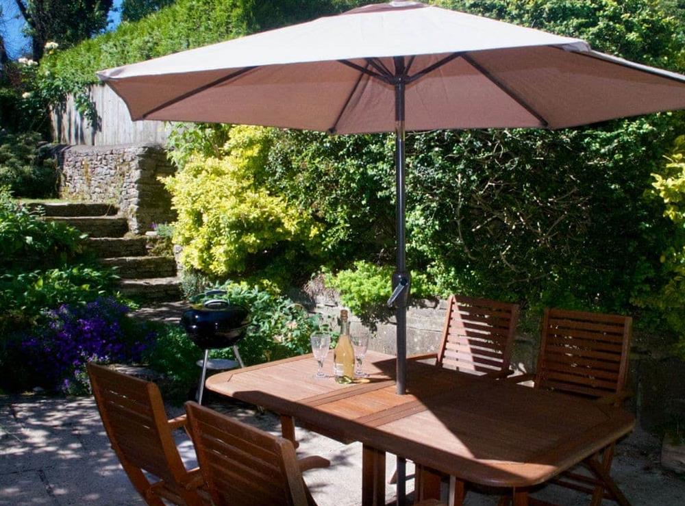 Delightfully shaded spot in the garden at Ivy Cottage in Chedworth, near Cheltenham, Gloucestershire