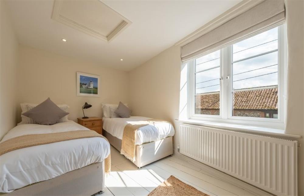 First floor: Bedroom three with twin beds at Ivy Cottage, Docking near Kings Lynn