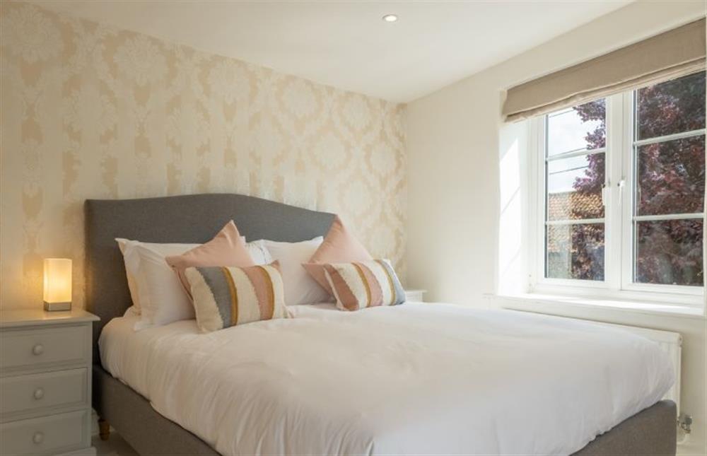 First floor: Master bedroom with balcony at Ivy Cottage, Docking near Kings Lynn