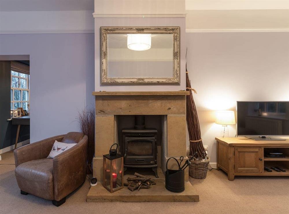 Cosy living room with multi-fuel burner (photo 2) at Ivy Cottage in Goathland, near Whitby, Lancashire