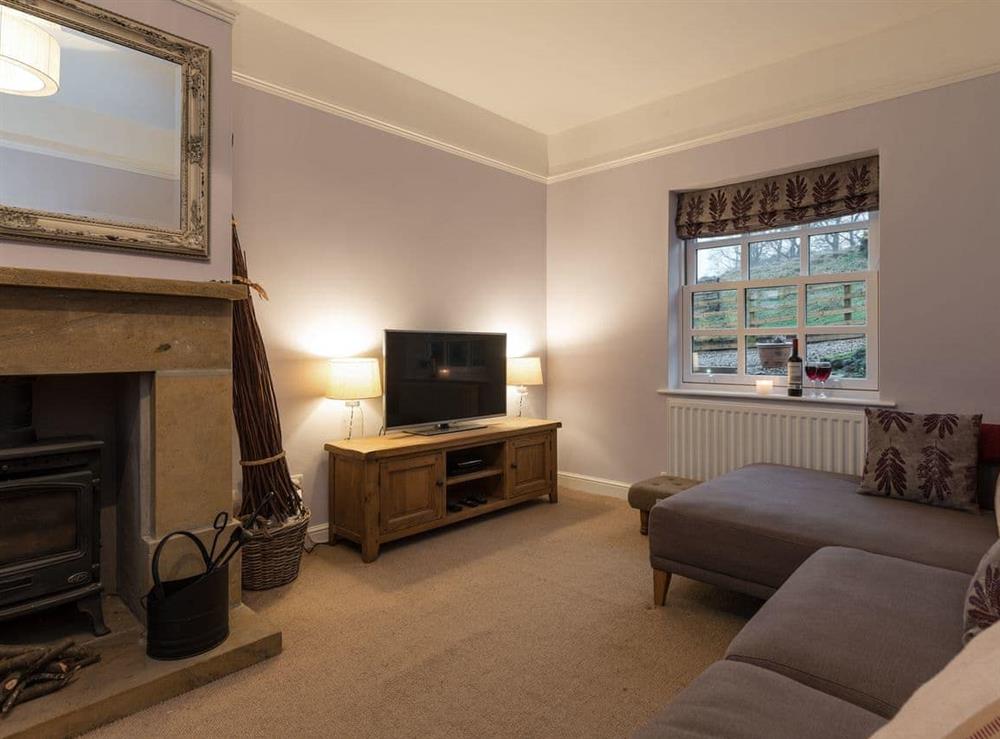 Cosy living room with multi-fuel burner at Ivy Cottage in Goathland, near Whitby, Lancashire