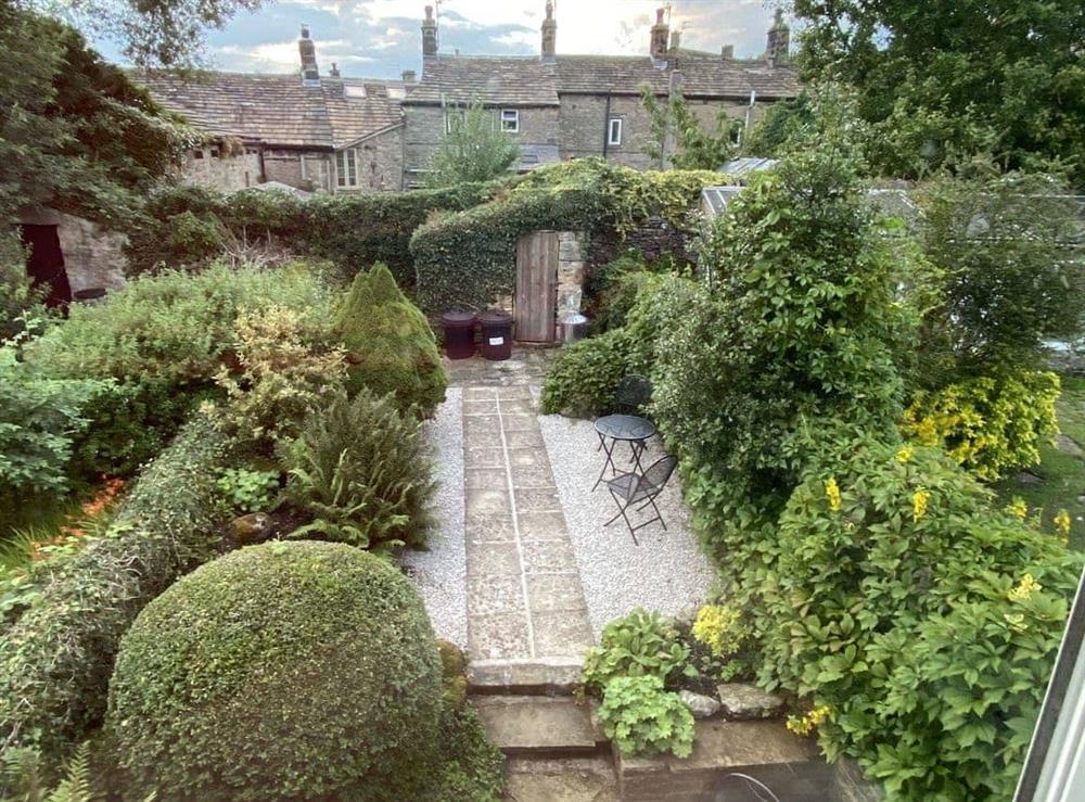Terraced rear courtyard with sitting out areas at Ivy Cottage in Grassington, near Skipton, North Yorkshire