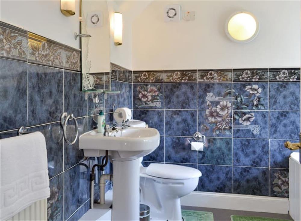 Family bathroom with shower over bath at Ivy Cottage in Kilcreggan, near Helensburgh, Dumbartonshire