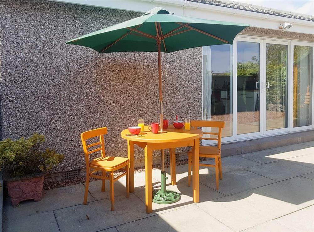 Enclosed courtyard with patio and garden furniture (photo 2) at Ivy Cottage in Montrose, Angus