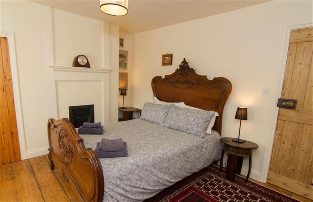 Bedroom one, antique french walnut double bed at Ivy Cottage (Thornham), Thornham near Hunstanton